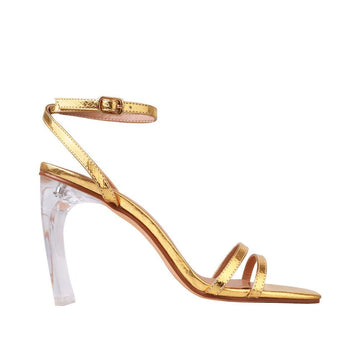 Translucent women heels with golden color upper and ankle buckle strap