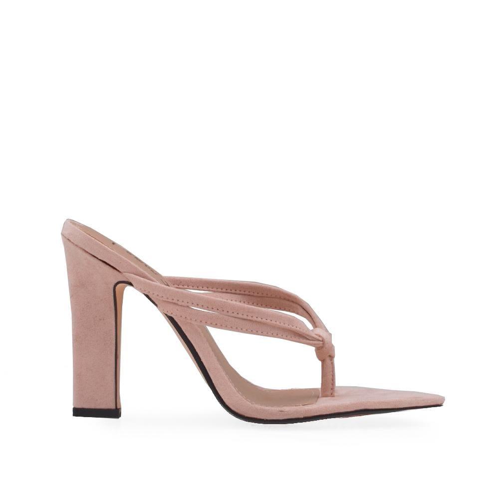 Nude colored heels with slip-on design and pointed toe