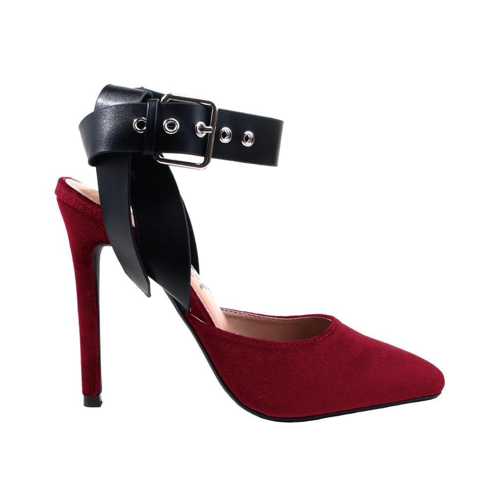 Red velvet top heels with black ankle buckle closure and pointed toe 