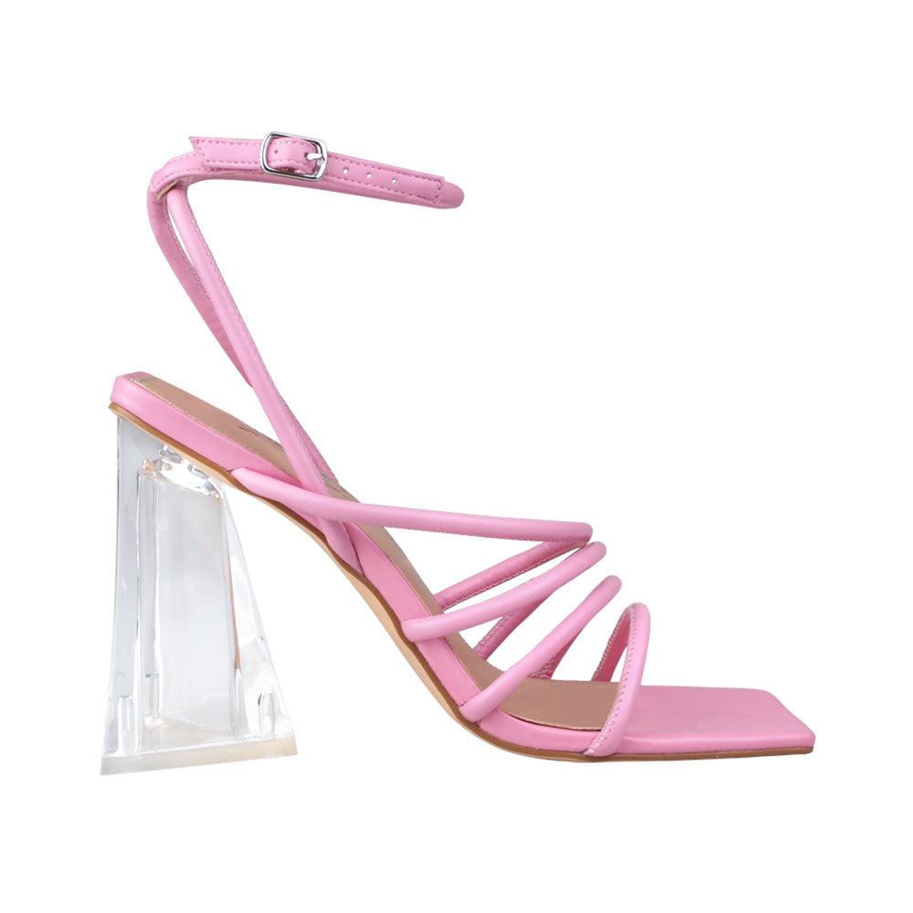 Pink translucent shoes in strappy sandal design with an ankle buck closure.