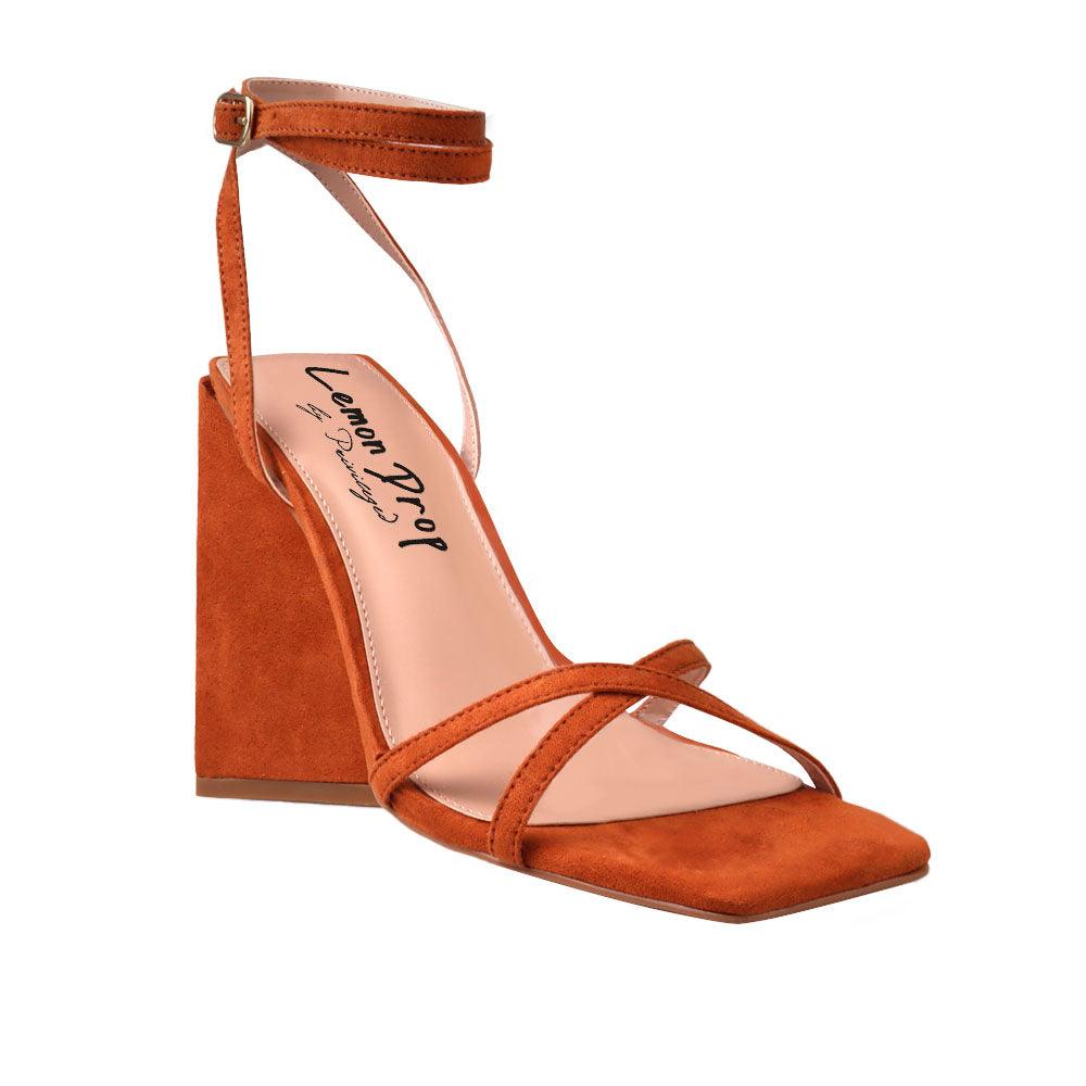 Women's cognac heels with an open toe and ankle buckle clasp.