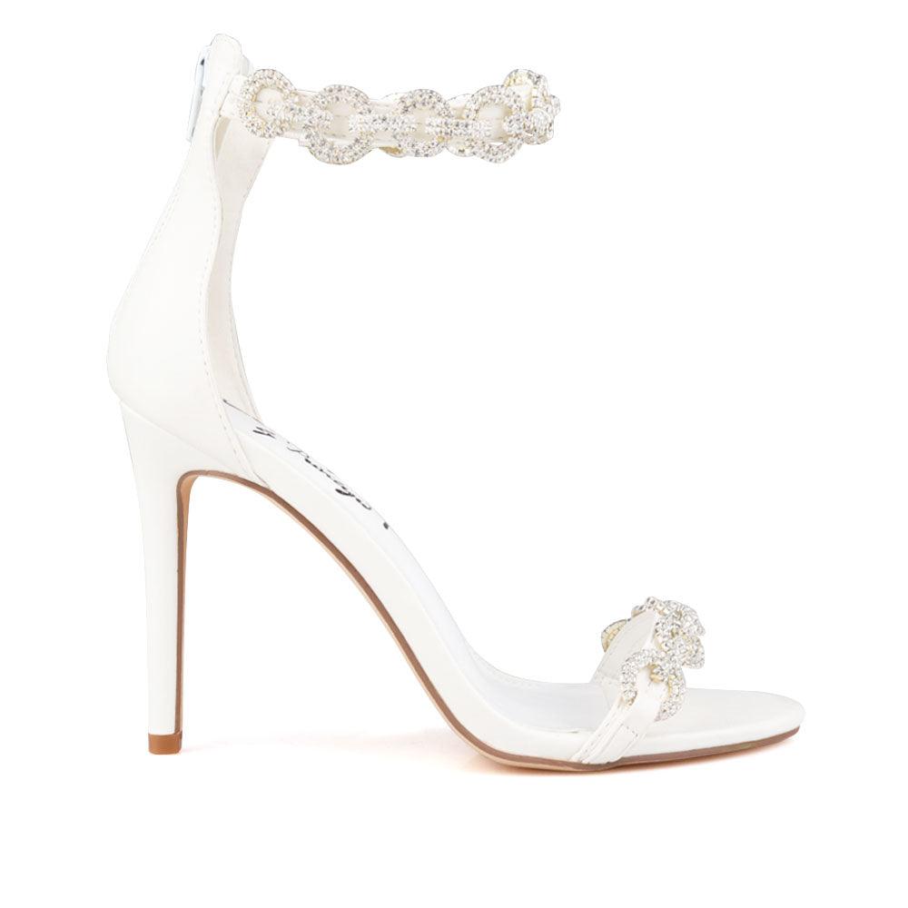 White slip-on heel with rhinestone chain adornment and back zip closure