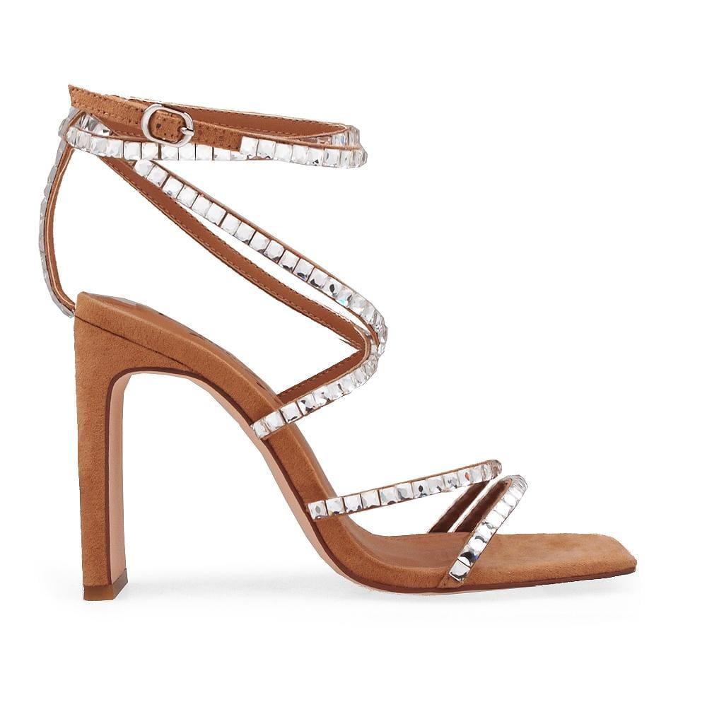 Tan heels with gem studded straps and an ankle buckle closure.