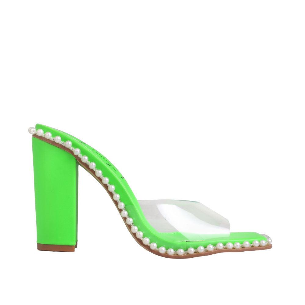 Women's green heels with bead embellishment on the side and clear upper.