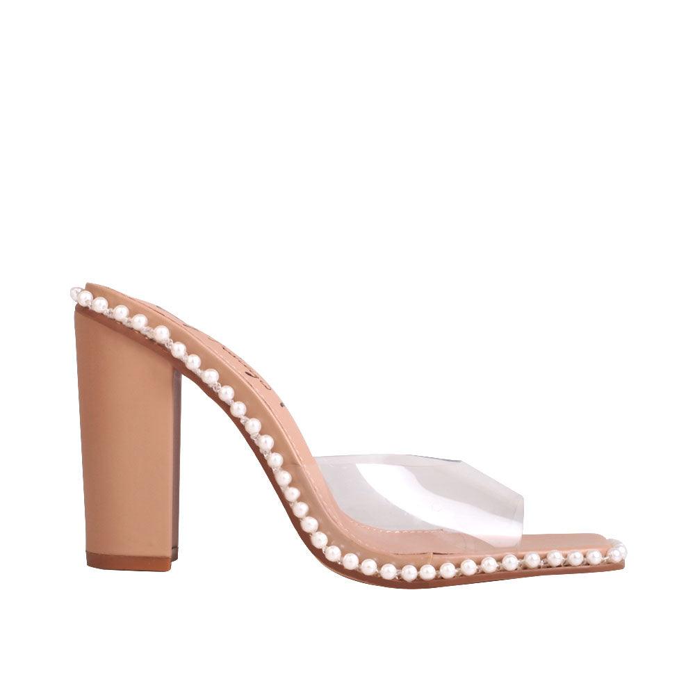 Nude heels for women with bead ornamentation on the side and clear upper.