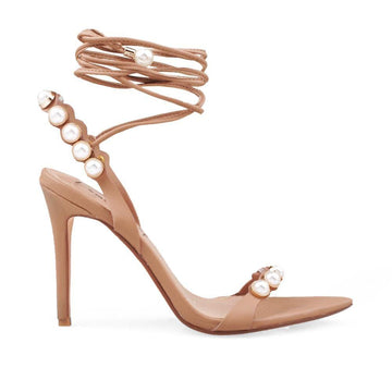 Tan colored women heels with pearl accent and ankle tie clasp
