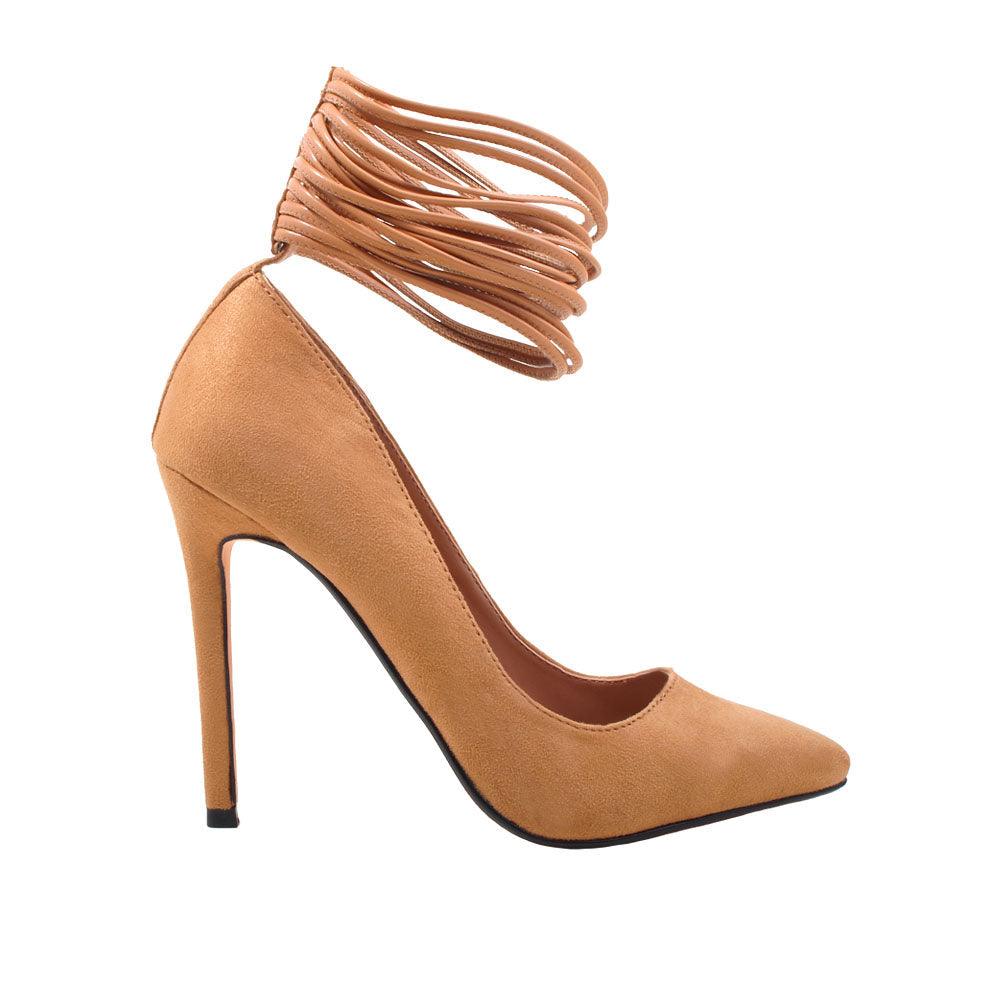 Nude colored heels with pointed toe, stiletto heel and rear button clasp with ankle tie design