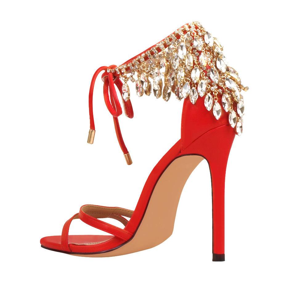 Red leather women's stiletto heels with marquise-shaped studs-posterior view