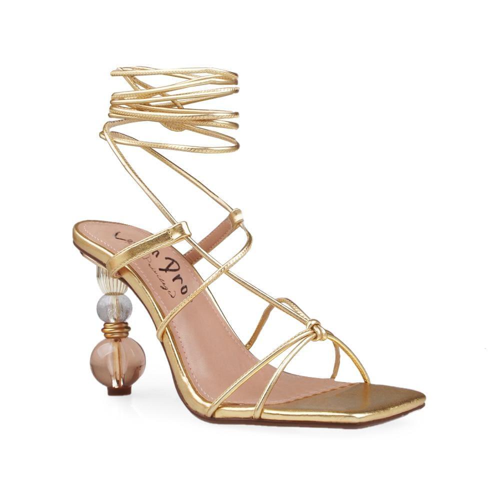 Gold lace front women's sandals with jewel decorated heel-corner view