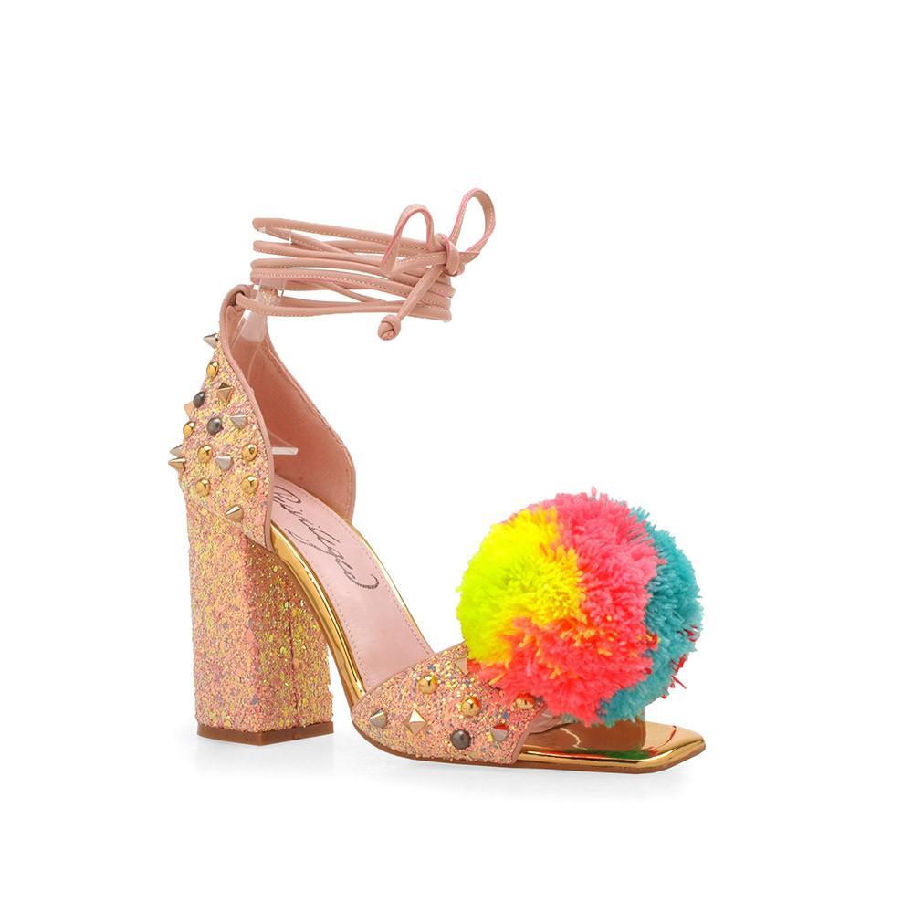 Pink luxury leather women's high heel with metal detailing and pom-corner view