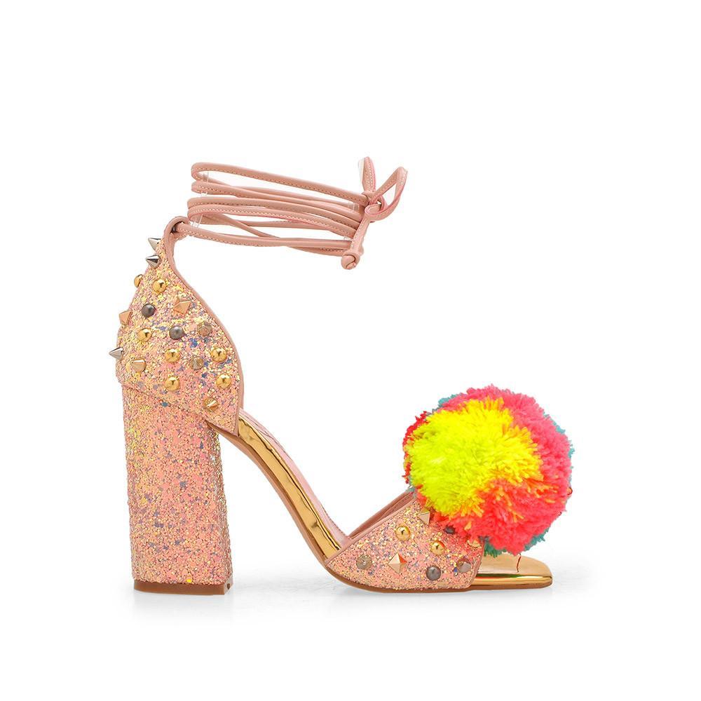 Pink luxury leather women's high heel with metal detailing and pom-side view