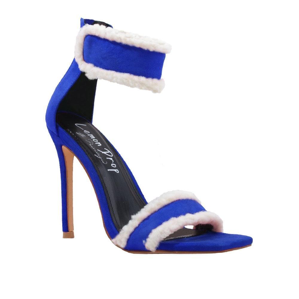 Women's faux suede heels in royal blue with a furry accent-corner view