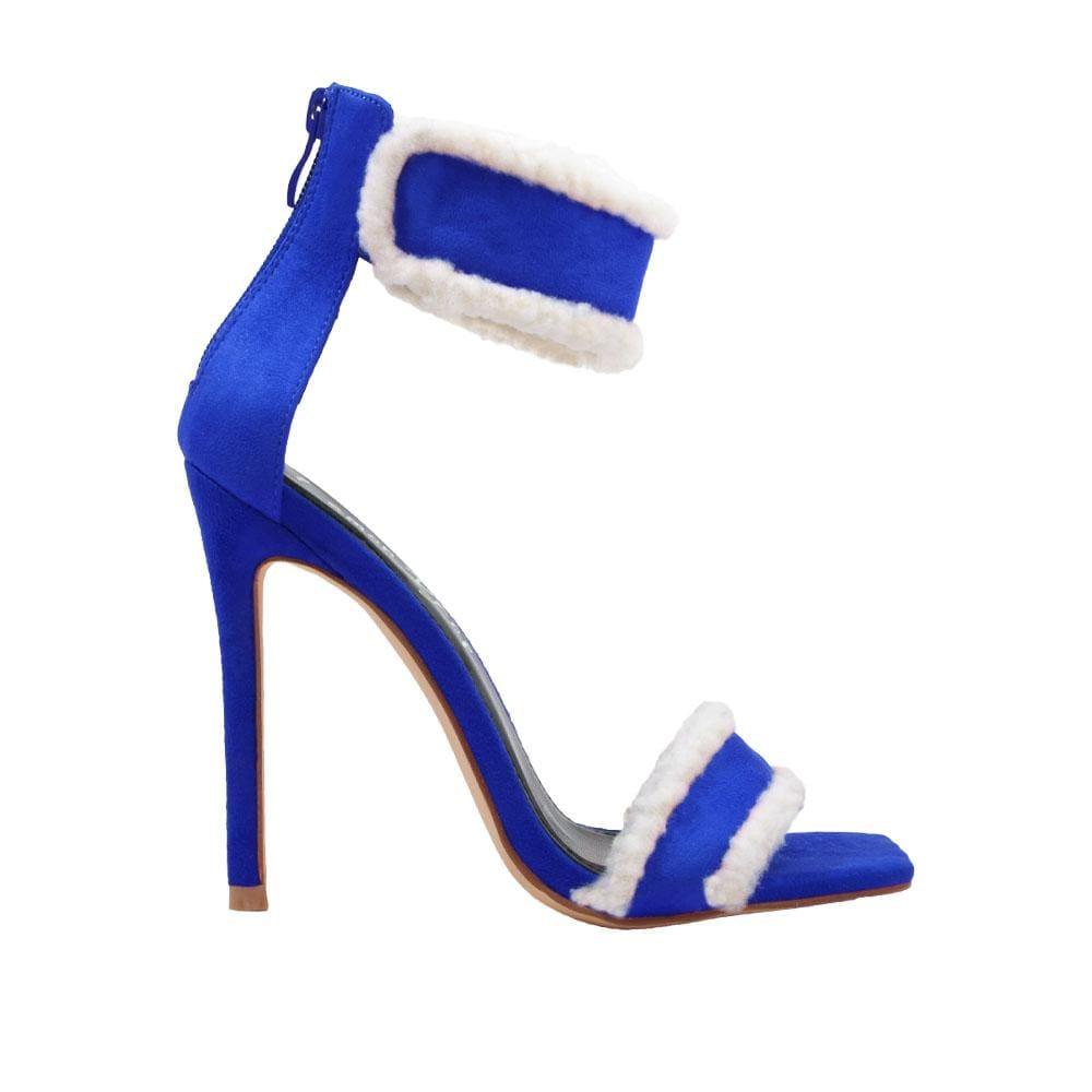 Women's faux suede heels in royal blue with a furry accent-side view