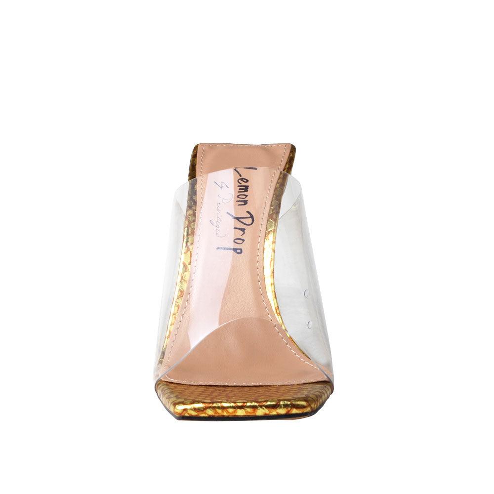 Clear vinyl upper with decorative women's block heel in gold-front view