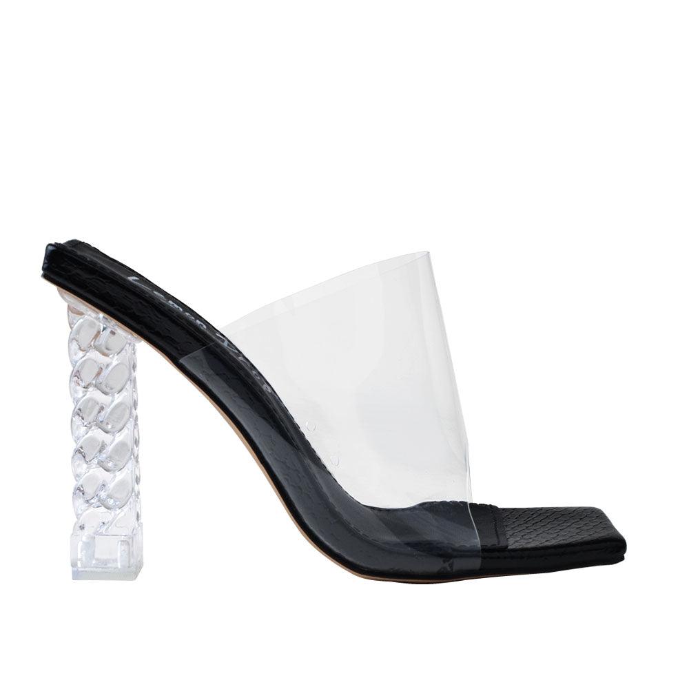 Clear vinyl upper with decorative women's block heel in black-side view