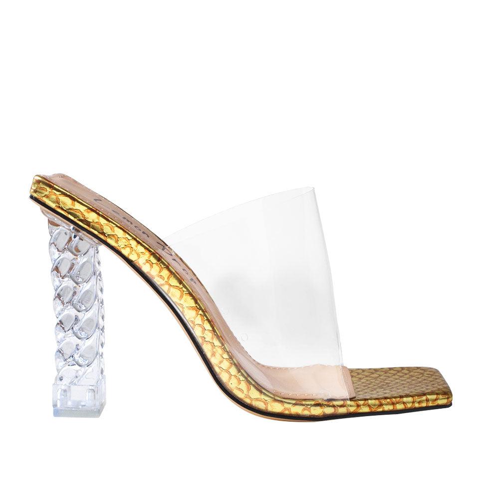 Clear vinyl upper with decorative women's block heel in gold-side view