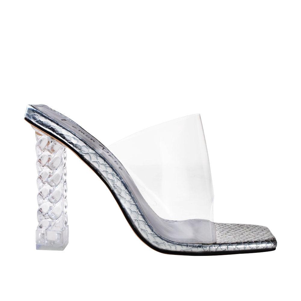 Clear vinyl upper with decorative women's block heel in silver-side view