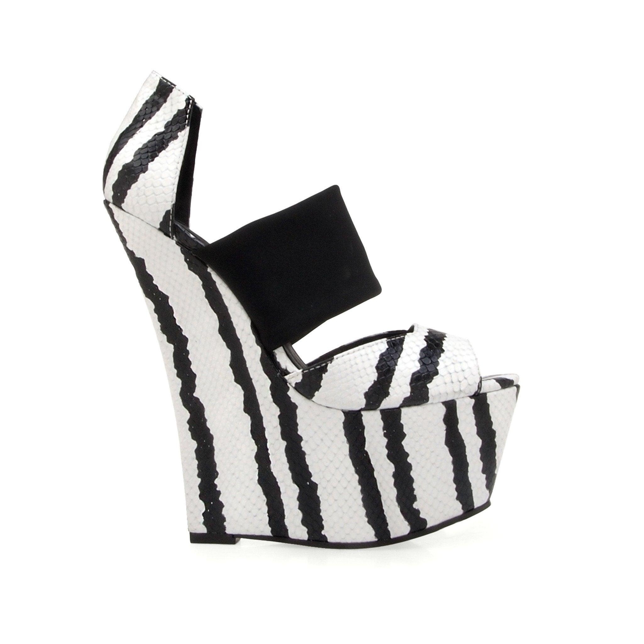 Black and white women's platform heel -side view