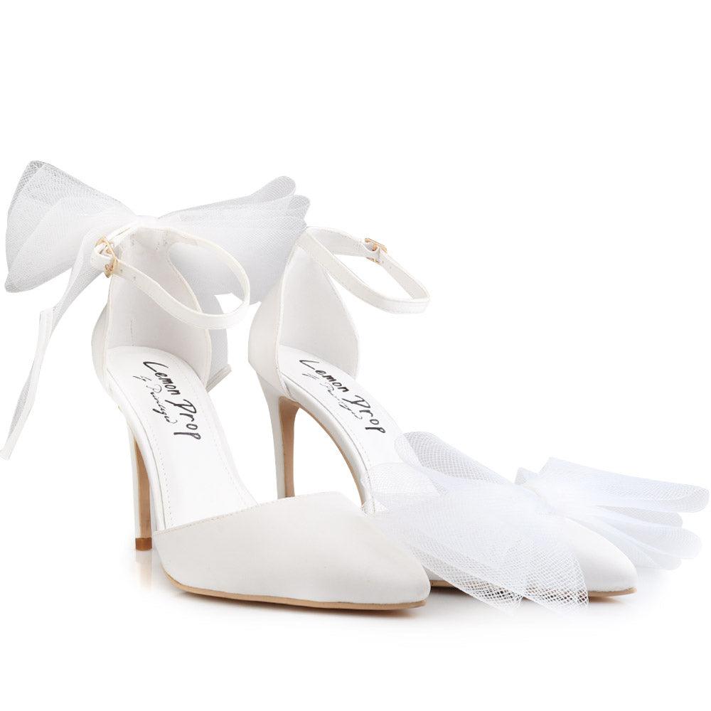 White coloured women's heel with front and back bow