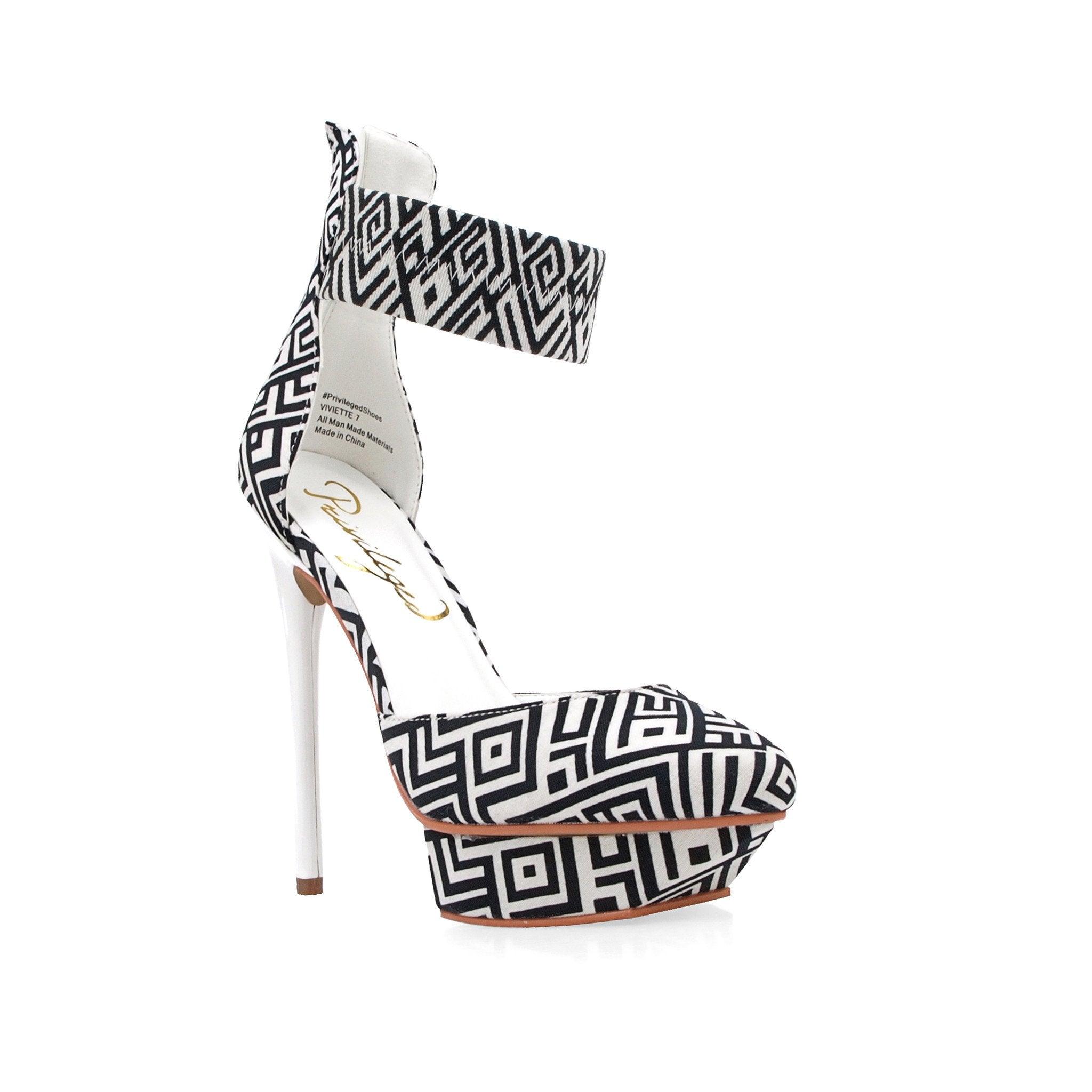 Black and white canvas fabric women's sandal heel-corner view