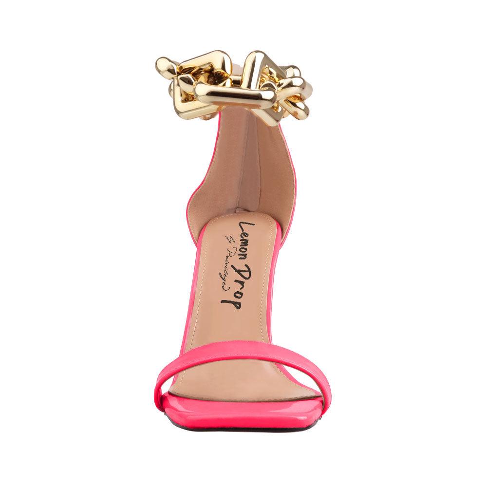 Neon pink, synthetic soled, vegan leather women's sandal heel with heavy chain detailing-front view