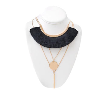 Women's necklace in gold with black tussles