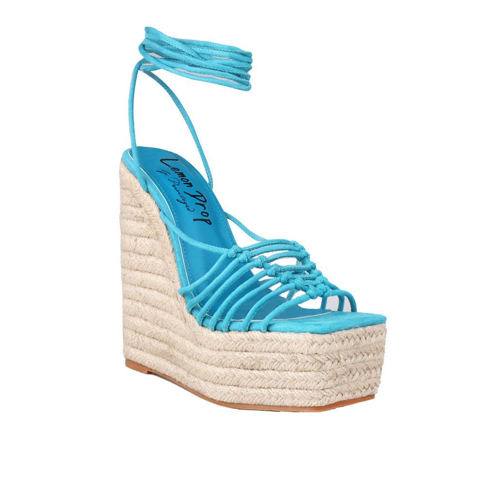 Women's turquoise ankle strap shoes with a wraparound ankle strap - corner view