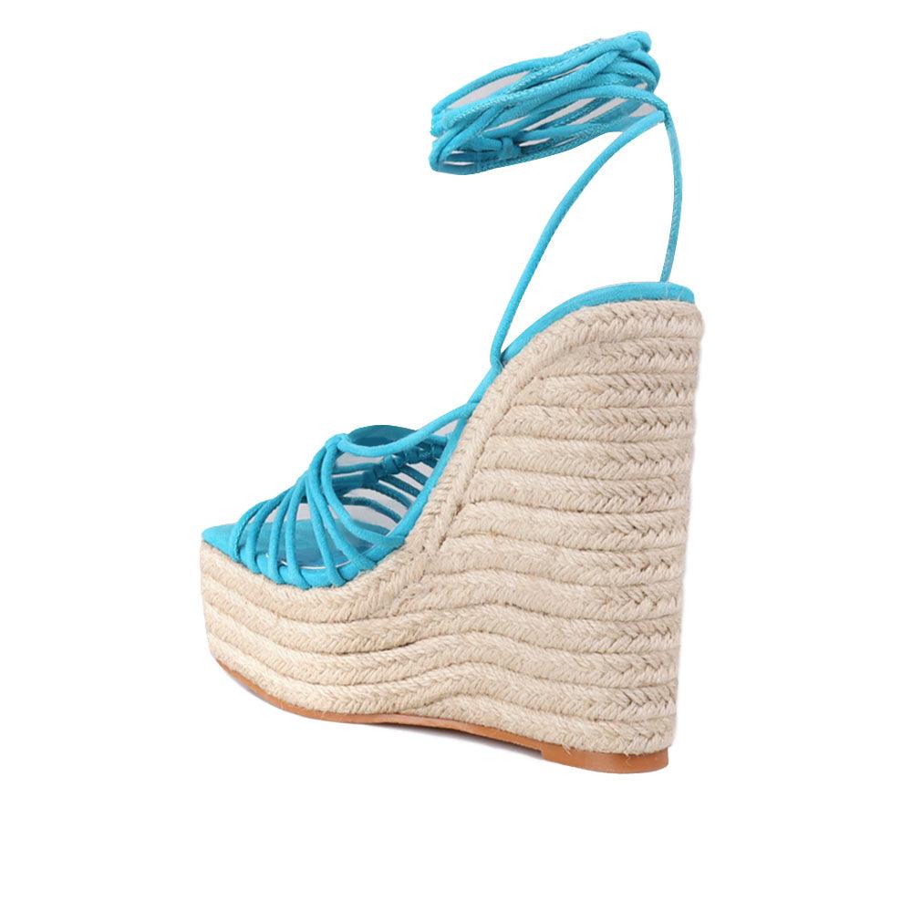 Women's turquoise ankle strap shoes with a wraparound ankle strap - posterior view