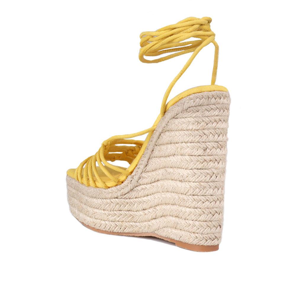 Wraparound ankle strap women shoes in mustard color - posterior view