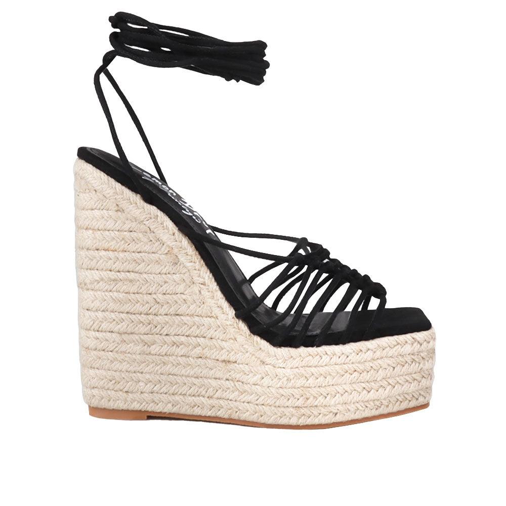 Black ankle strap women shoes with a wraparound ankle strap - side view