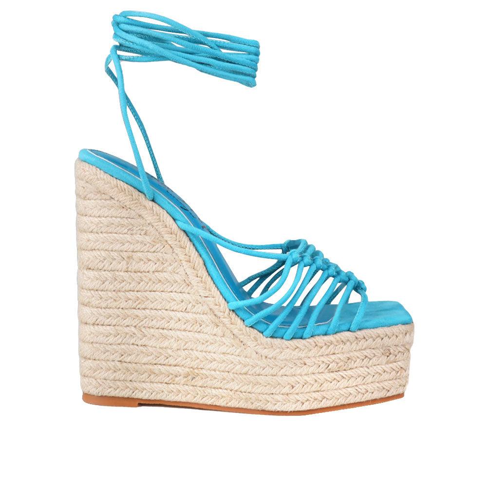 Women's turquoise ankle strap shoes with a wraparound ankle strap - side view