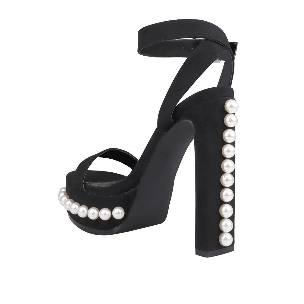 Black open-toed heels for women with a beaded design on the heel and bottom-posterior view