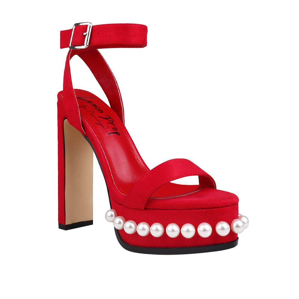 Red colored women heels with open toe and beads design on bottom-corner view