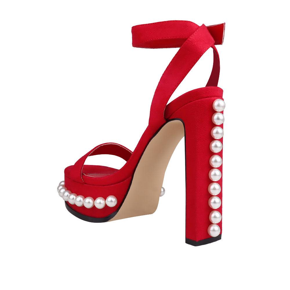 Red colored women heels with open toe and beads design on bottom-posterior view