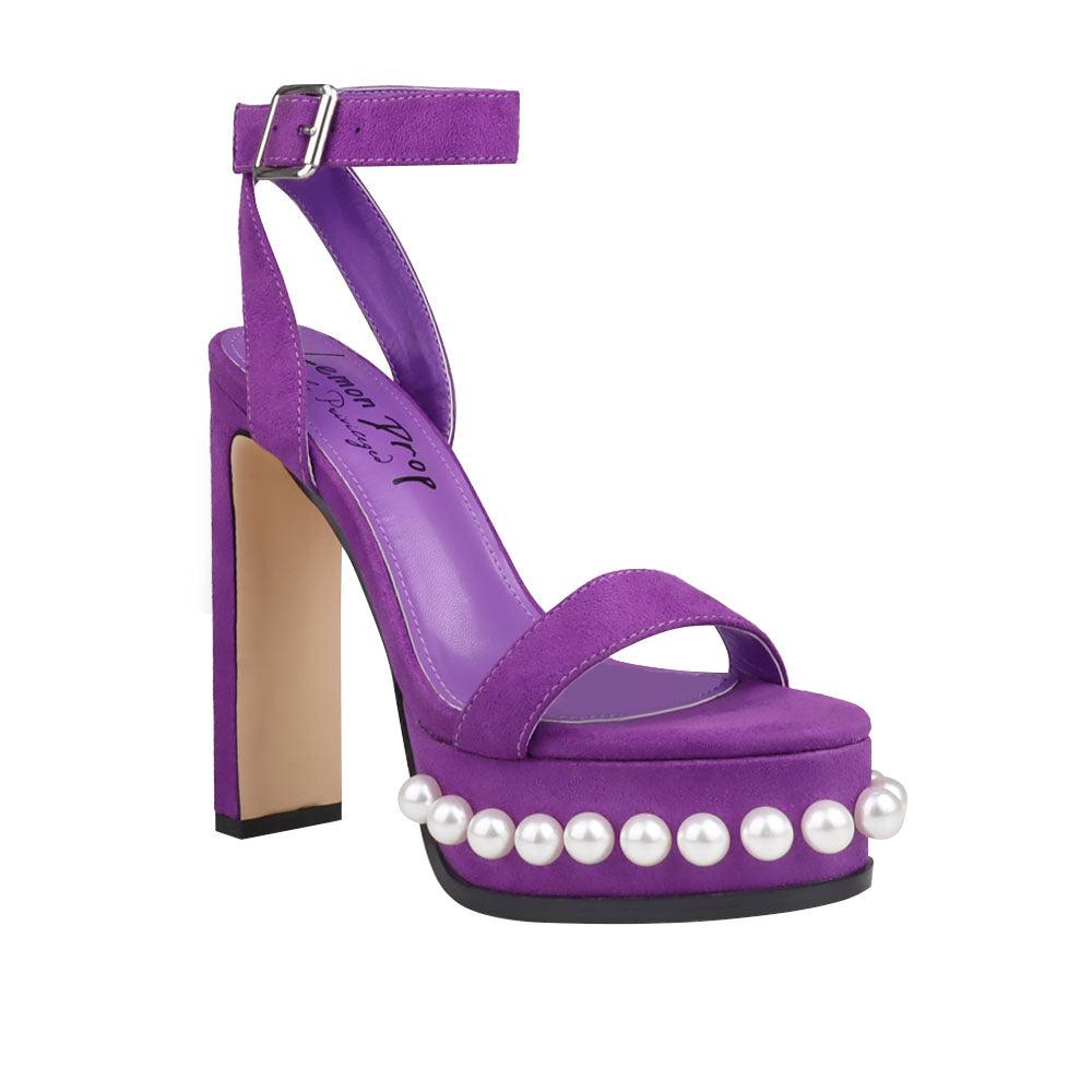 Women's heels in purple color with an open toe and a beaded pattern on the bottom-corner view