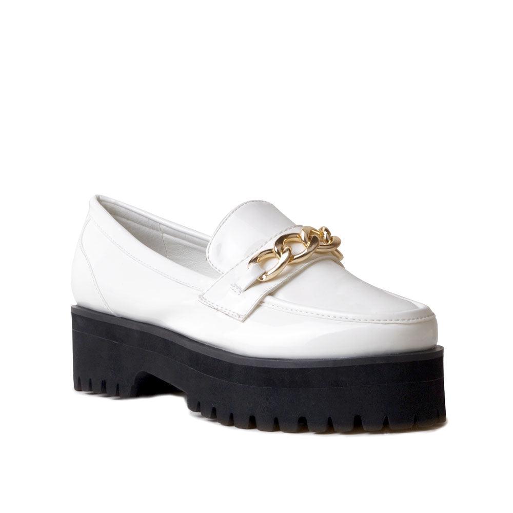 White leather women's shoes with metal chain and thick black bottom-corner view