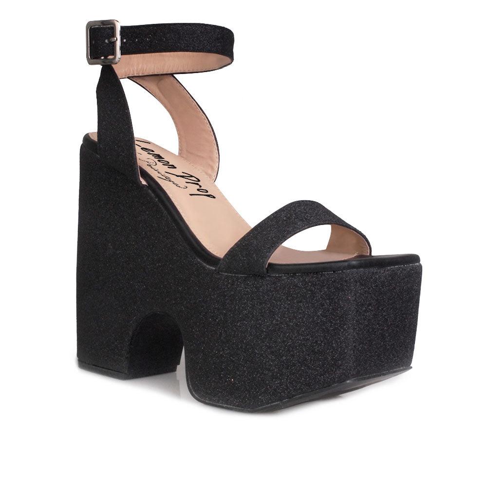 Women's platform shoes in black colored with a sandal buckle-corner view