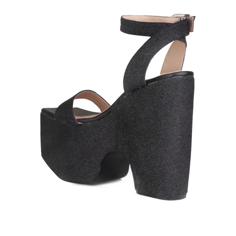 Women's platform shoes in black colored with a sandal buckle-posterior view