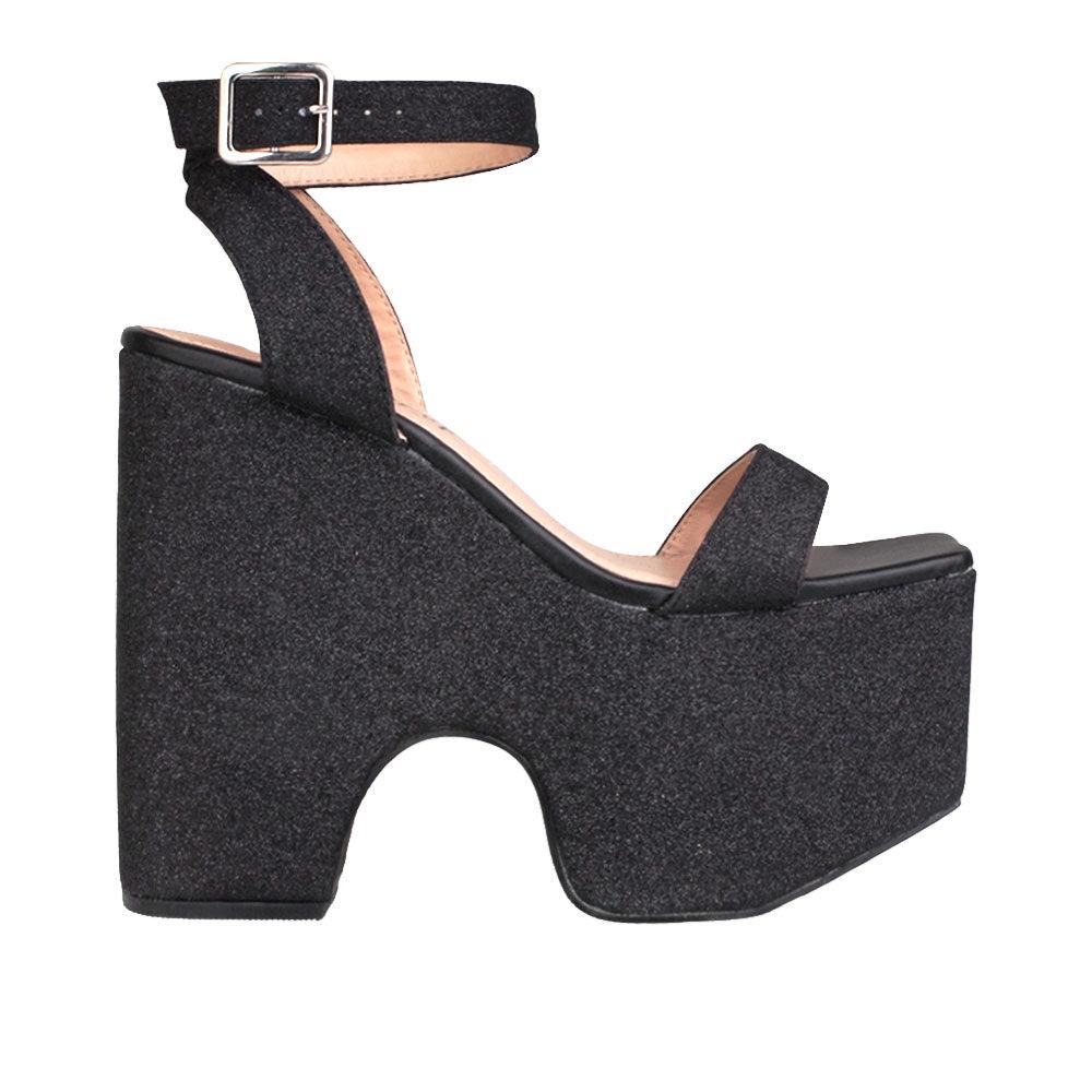 Women's platform shoes in black colored with a sandal buckle-side view