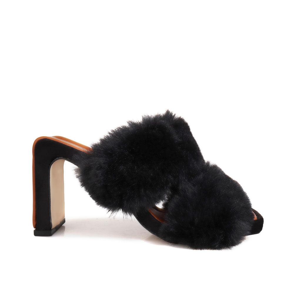 Toe heel open platform in black colored with furry heeled slippers-side view