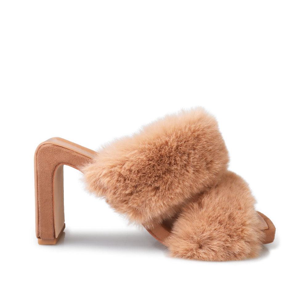 Tan colored toe heel open platform slippers with furry heels-side view