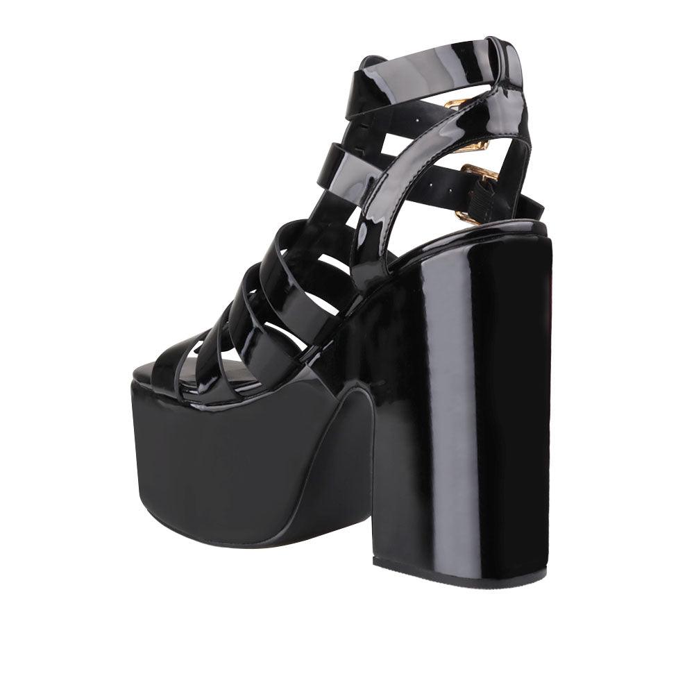 Black-colored  wedge block heels for women with double sandal buckle and strap design-posterior view