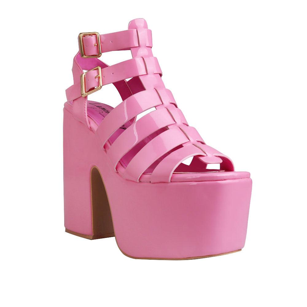 Women wedge block heels in pink  color with double sandal buckle and strap design -  corner view