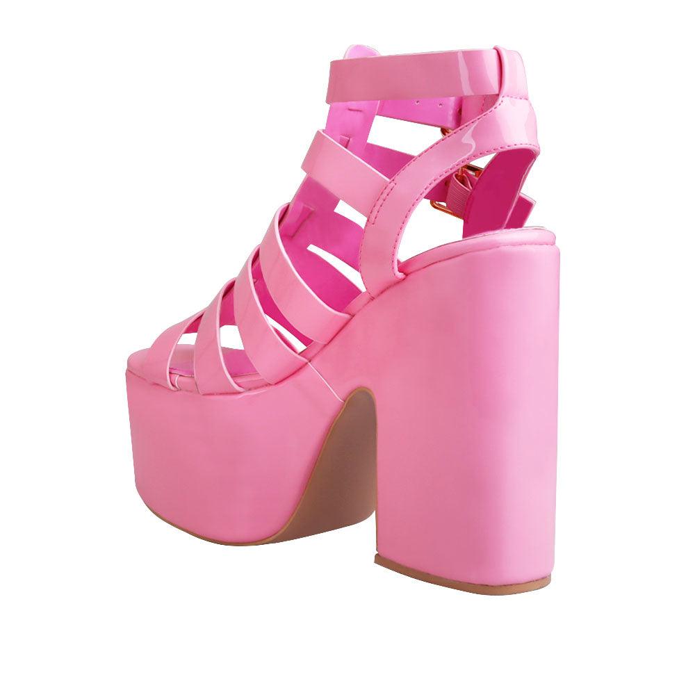 Women wedge block heels in pink  color with double sandal buckle and strap design - posterior view