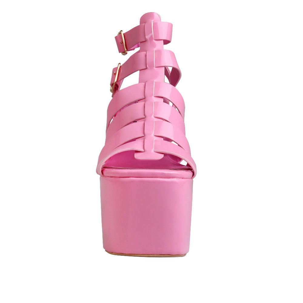 Women wedge block heels in pink  color with double sandal buckle and strap design - front view