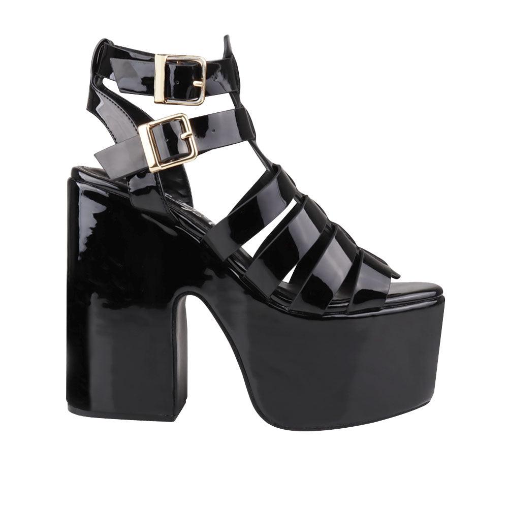 Black-colored  wedge block heels for women with double sandal buckle and strap design-side view