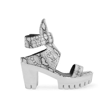Platforms in white with an ankle fastening and a black-white snake design upper-side view