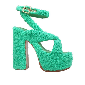 Shearling upper platform crossed strap block heels in green-color with ankle buckle fastening-side view