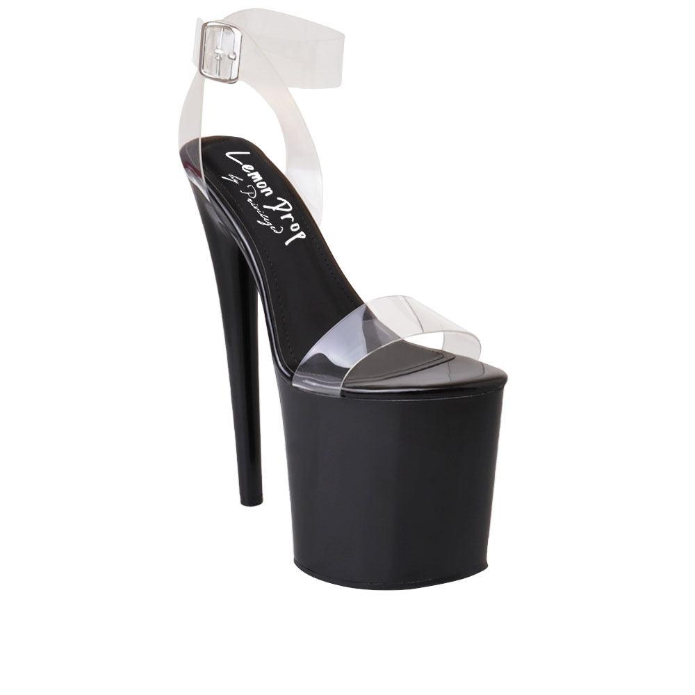 Black-colored women's high heel platform shoes with upper transparent strap and ankle buckle closure-corner view