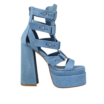 Denim-colored women's platform shoe heels with decorative buckle straps and back zipper-side view
